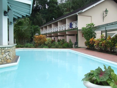 Arnos Vale Resort: pool and building with guest rooms